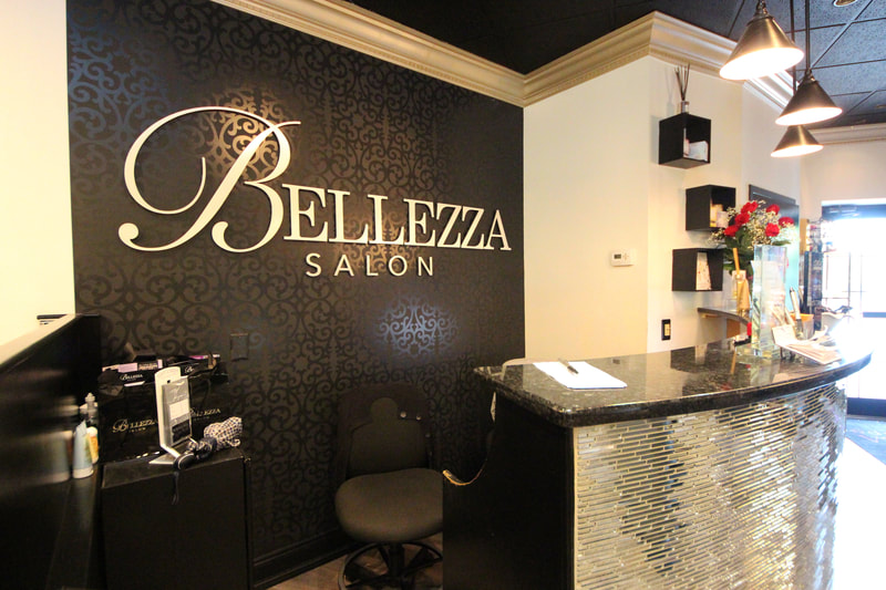 Bellezza Salon front lobby with name on black wall